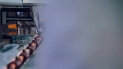 Food packaging line. Sweet food production line. Food processing plant. Packaging process of cheese rods. Food factory. Chocolate desserts on conveyor belt at chocolate factory. Food industry Stock Footage