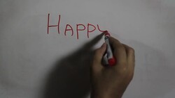 Hand writing a 'Happy Birthday' on a white board Stock Footage