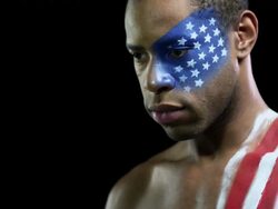 Man with US flag painted on face and shoulder Stock Footage