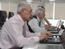 HD DOLLY: Business Students Practice Financial Softwares Stock Footage