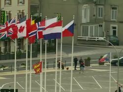 CU, ZO, WS, HA, International flags of allied forces at Arromanches and beach, Normandy, France Stock Footage