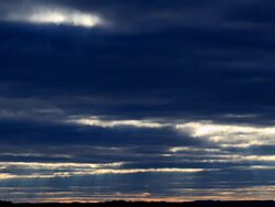 T/L Sun ray beams, passing through clouds. Progressive frames Stock Footage
