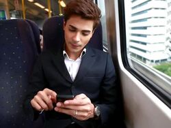 HD:Young businessman typing message on the train. Stock Footage