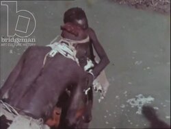 Journey For Survival part two - Water delivered to village. Dirty water holes in Ethiopia and the Yemeni desert. Women talking to cameras. Stock Footage