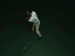 SLO MO WS HA Studio shot of golf player teeing off Stock Footage