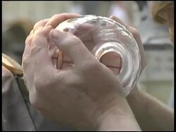 Glassworking: Etching Crystal Vase on Rotating Blade Stock Footage