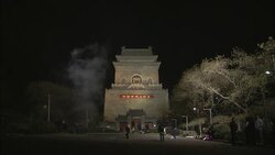 Residents light fireworks in front of a large monument in Beijing. Stock Footage