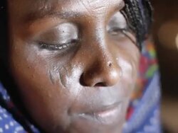 Woman stirring pastry of Ethiopian dish Stock Footage