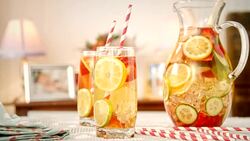 Infused Water with Fresh Strawberries, Lime, Lemon and Basil Stock Footage