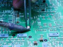 Electronic solder components welding green board Stock Footage