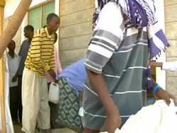 Refugees in line waiting for food distribution Stock Footage