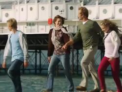 MS, PAN, Family with two children (10-11, 12-13) walking on Brighton beach, Brighton, Sussex, United Kingdom Stock Footage