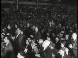 A crowd gives a standing ovation. News Clip