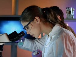 HD DOLLY: Scientist Inspecting A Microscope Slide Stock Footage