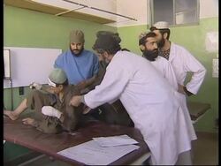 Wounded in hospital in Kandahar following bombing. News Clip