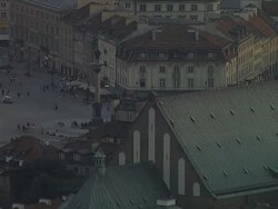 A panorama of Warsaw's Old Town with The Cathedral of St. John The Baptist, the Royal Castle and Zygmunt's Column. People walking around the column. Stock Footage