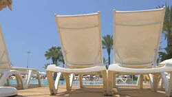 Video of sunbeds in tropical resort in 4K Stock Footage