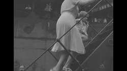 Women and children flee Singapore after it falls into Japanese hands in 1942 News Clip