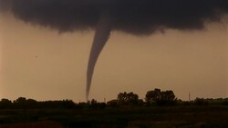 A tornado hovers in a pale orange sky. Stock Footage
