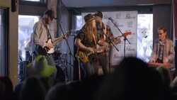 Bearded country rock band play in Austin bar during South By Southwest music festival Stock Footage