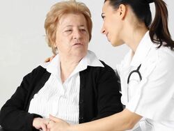 Young  nurse with her senior female patient. Stock Footage