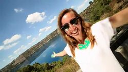 Young woman takes selfie portrait at Blue lake, South Australia Stock Footage