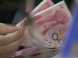 Bank teller counting Chinese Renminbi bank notes News Clip