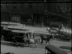 Helen Keller visits a bustling New York City complete with horse-drawn trolleys and carts among other traffic. News Clip