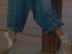 woman in overalls and ballet slippers dancing with American flag Stock Footage