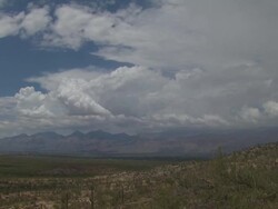 Pan across open plains and mountains of Sonoran desert near Tucson, Arizona, USA. Stock Footage