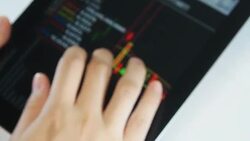 Man Browsing Stock Quotes on digital tablet Stock Footage