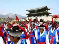 MS Shot of men walking in costume parade of Ancestral Ritual Formalities for Jongmyo Shrine through downtown road / Seoul, South Korea Stock Footage