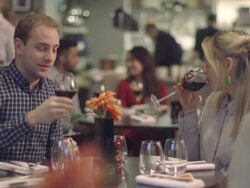 MS Young couple enjoying food in restaurant Stock Footage