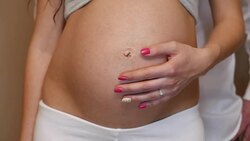 stroking the big belly Stock Footage