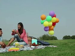Young couple enjoying in the park, Delhi, India Stock Footage