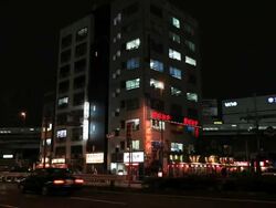 MS Bullet train shinkansen passing in city at evening / Shinbashi, Tokyo, Japan Stock Footage