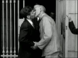 Eugene V. Debs leaves Atlanta Federal Prison and is presented a bouquet of flowers. News Clip