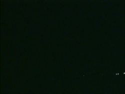 Time lapse WA Lightning lights up rain clouds in night sky, over silhouetted countryside, USA Stock Footage