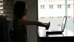 Tired woman with a laptop Stock Footage