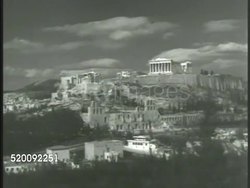 1948: ACROPOLIS OF ATHENS: * WS Acropolis (or 'High City') of Athens, coliseums, Parthenon, Greek architecture. HA WS Government building. LS Greek guards, soldier standing on porch of building. Greece, Cold War Instructional Video