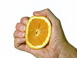 CU SLO MO Hand of man squeezing orange / Vieux, Normandy, France   Stock Footage