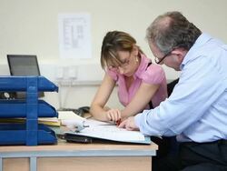 Office colleagues in a candid meeting Stock Footage