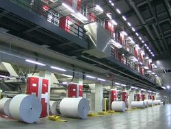 WS Shot of worker working in web press at newspaper printing office / Russelheim, Hesse, Germany Stock Footage