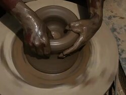 Man making a earthen pot on a pottery wheel  Stock Footage