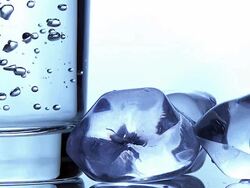 CU SLO MO Shot of Bubbles in Glass and Ice Cubes / Vieux Pont en Auge, Normandy, France  Stock Footage