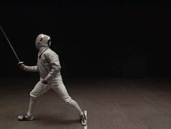 Fencers lunging and striking in match Stock Footage