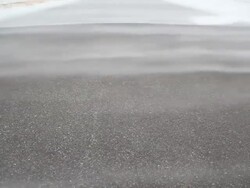 Snow Blowing over Winter Road Stock Footage