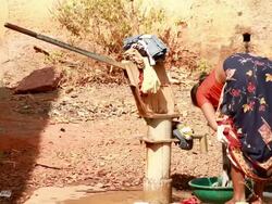 Rural Indian woman washing clothes Stock Footage