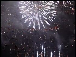 A bird's eye view of the sights and sounds of a New York City Fourth of July celebration. News Clip