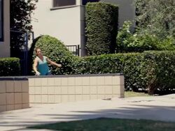 Girl doing Parkour - Vaults wall then side flips Stock Footage